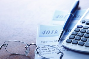 Calculator and Documents at the Scene of Retirement Planning Services in Peoria IL